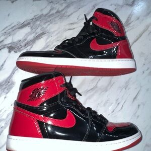 Jordan Black and Red High-Top Sneakers
Jordan 1 High OG Patent Breds 
Size 12